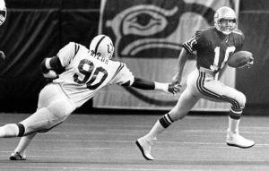 Zorn puts his scrambling prowess on display in a game against the Baltimore Colts in the Seattle Kingdome.